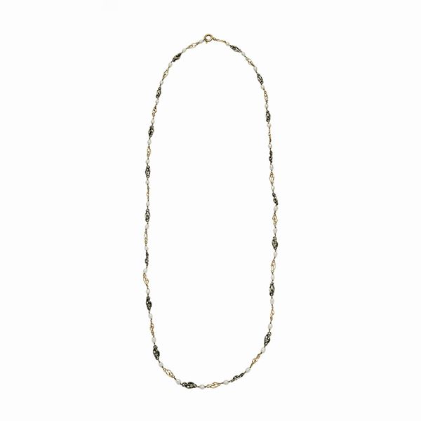 Necklace in yellow gold, silver and pearls