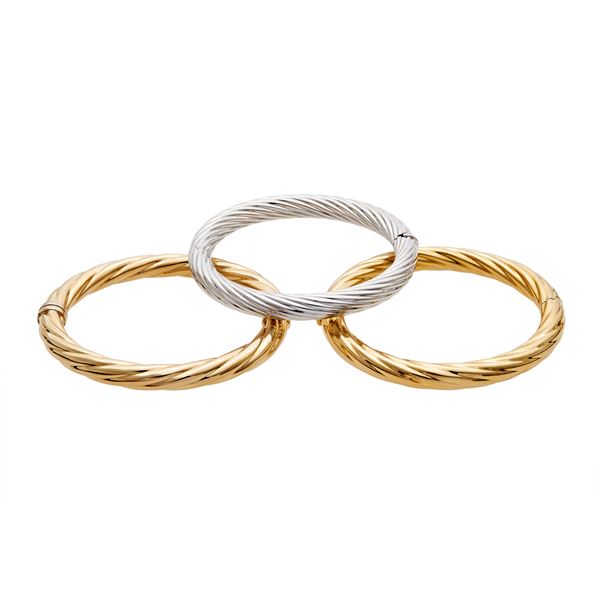Three rigid bracelets in gold