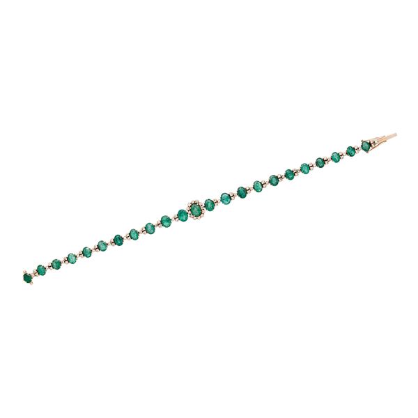 Tennis bracelet with emeralds and diamonds