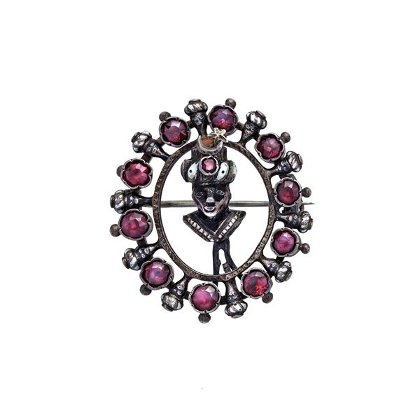 Brooch with garnet and black and white enamel