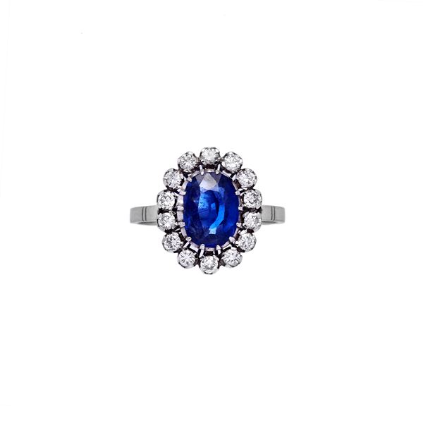 Daisy ring with diamonds and sapphire