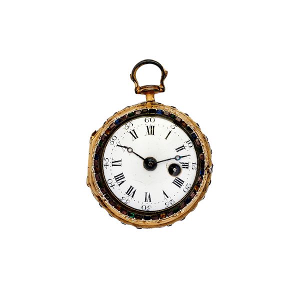 Gold pocket watch and colored stones