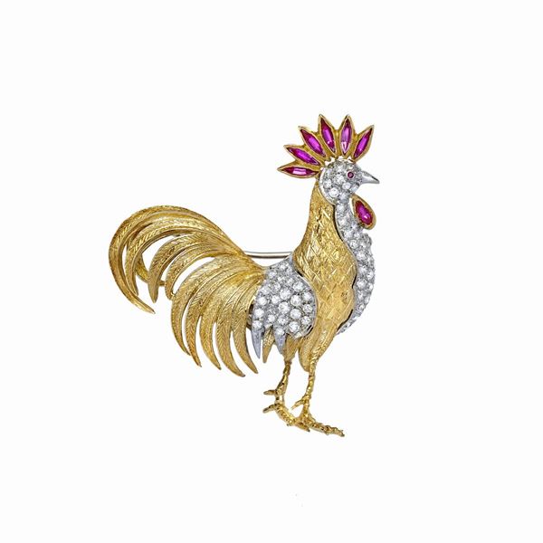 Gold brooch in white, yellow gold, rubies and diamonds