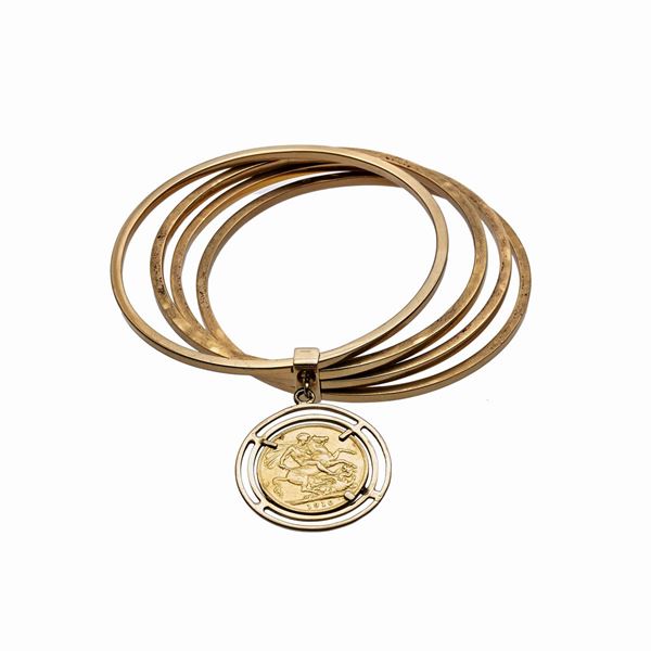 Bracciale rigido in oro giallo con sterlina