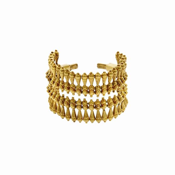 High rigid bracelet in yellow gold