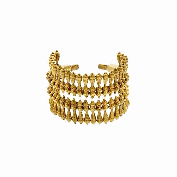 Alto bracciale rigido in oro giallo