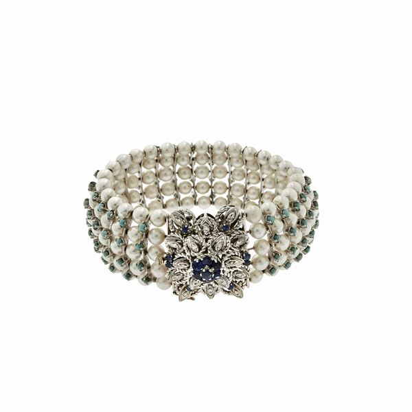 Bracciale rigido in oro bianco, perle, turchesi, zaffiri e diamanti