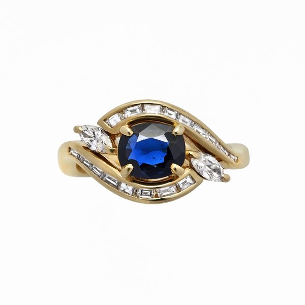 DAMIANI - Yellow gold ring, diamonds and Damian sapphire