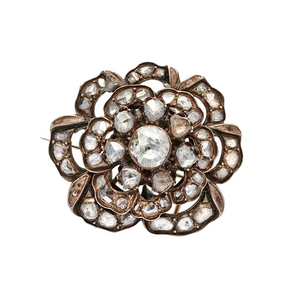 Low cut gold flower brooch and old cut diamonds