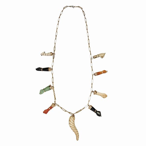 Necklace in yellow gold and low titanium gold, corniola, onyx, red coral, jade and bone