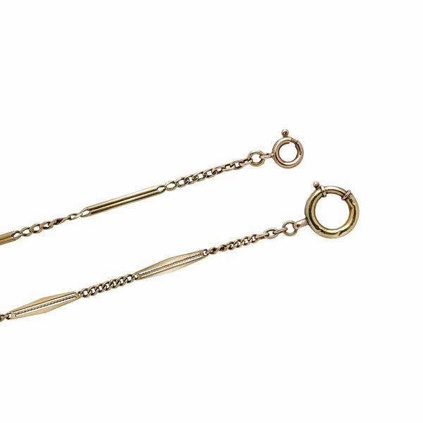 Due catene da orologio in oro giallo