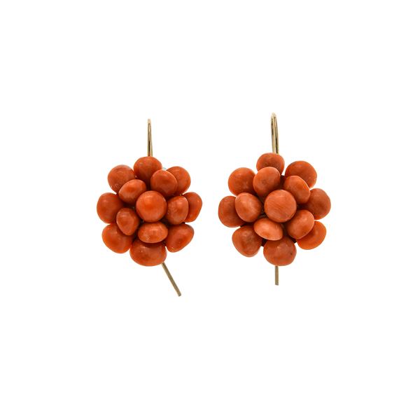 Pair of flower earrings in a low titer gold and pink coral