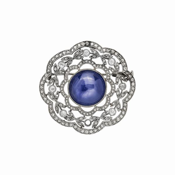 White gold brooch, diamonds and light sapphire