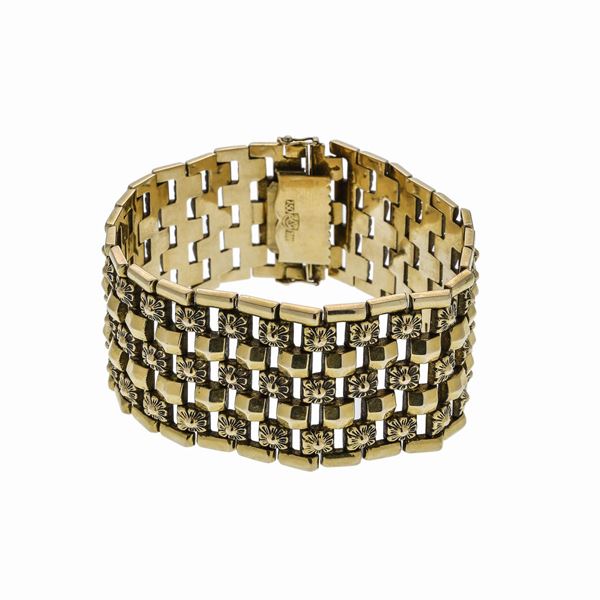 Alto bracciale in oro giallo