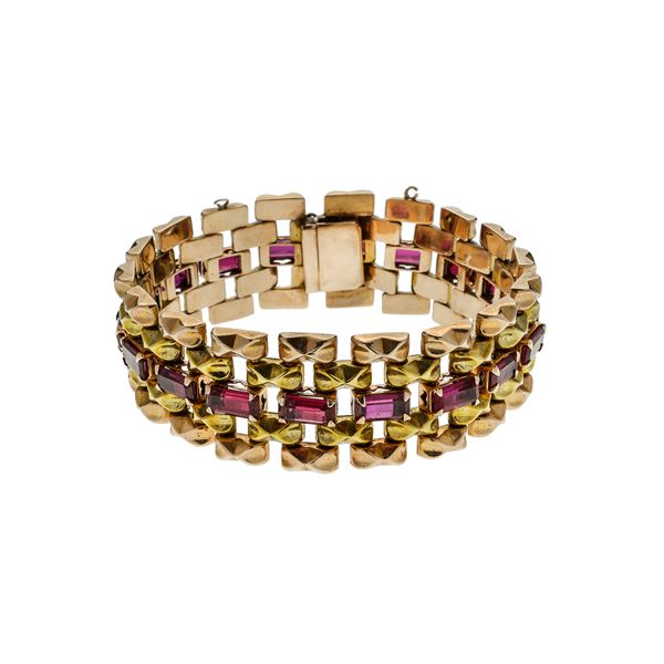 Bracelet in yellow gold, pink gold and red stones