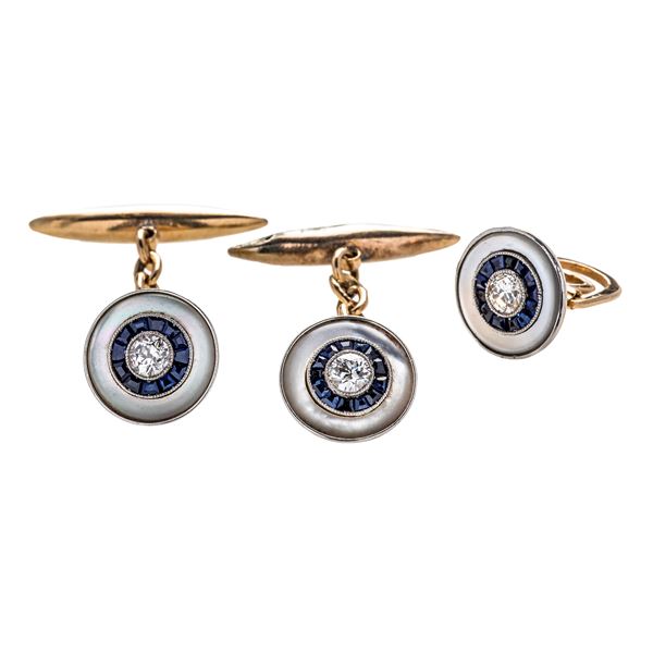 Pair of wrist cuff links in yellow gold, platinum, mother of pearl, sapphires and diamonds