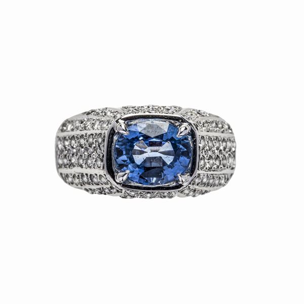 White gold ring, diamonds and light sapphire