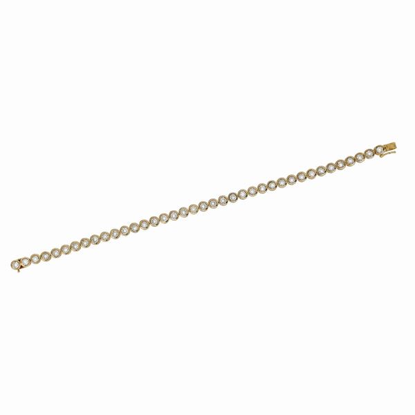 Bracciale tennis in oro giallo e diamanti