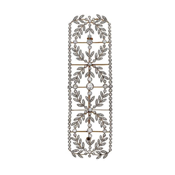 Part of tiara in yellowgold, platinum and diamond