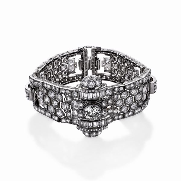 Importante bracciale orologio in platino e diamanti