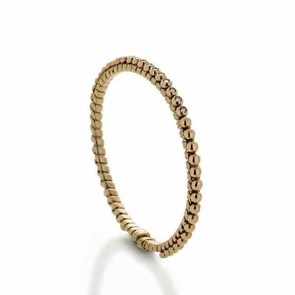 Bracciale semirigido in oro giallo e diamanti