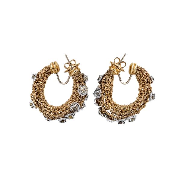 Pair of earrings in yellow gold, white gold, diamonds and brown diamonds