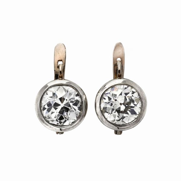 Pair of a fish hook earrings in white gold and diamonds