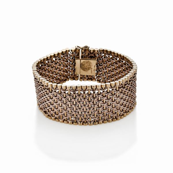 Alto bracciale in oro giallo e oro rosa a basso titolo