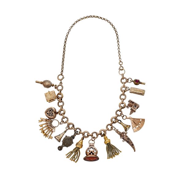 Necklace in gold low titer and charms of various shapes