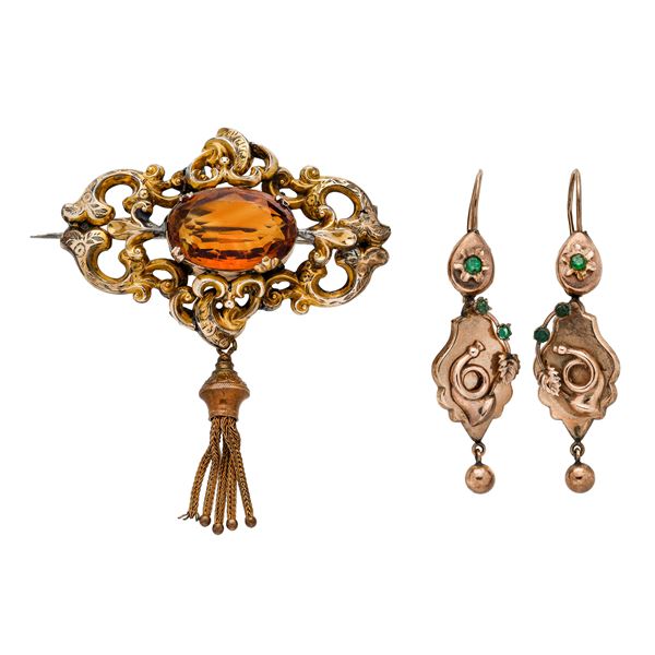 Lot: pair of earrings and brooch in gold with a low title