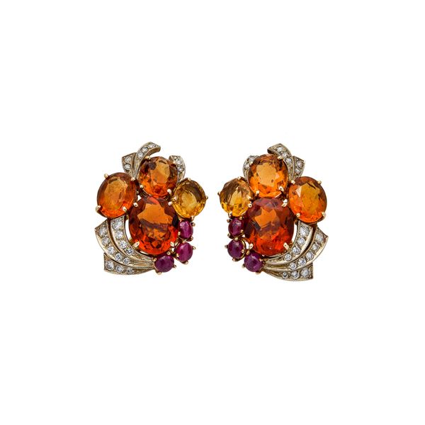 Pair of clip earrings in yellow gold, diamonds, rubies, topazes and citrine quartzes