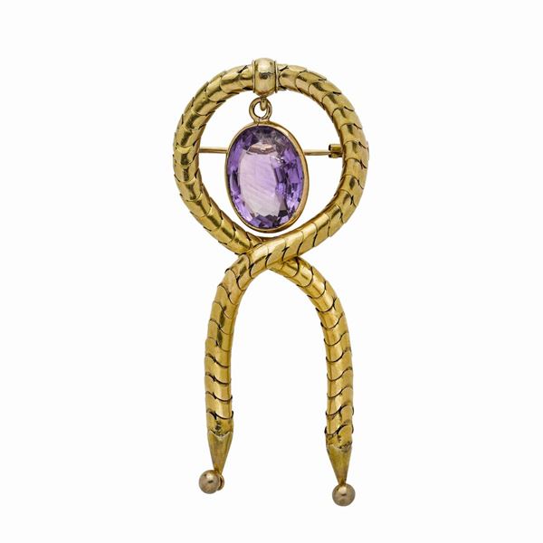 Brooch in yellow gold and amethyst
