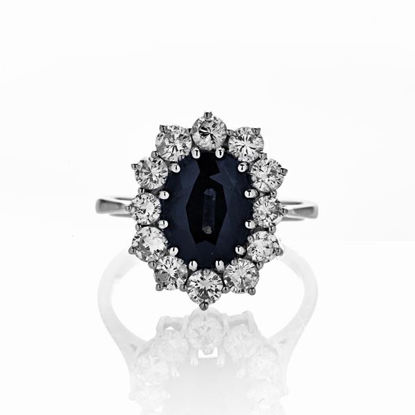 Ring in white gold, diamonds and sapphire