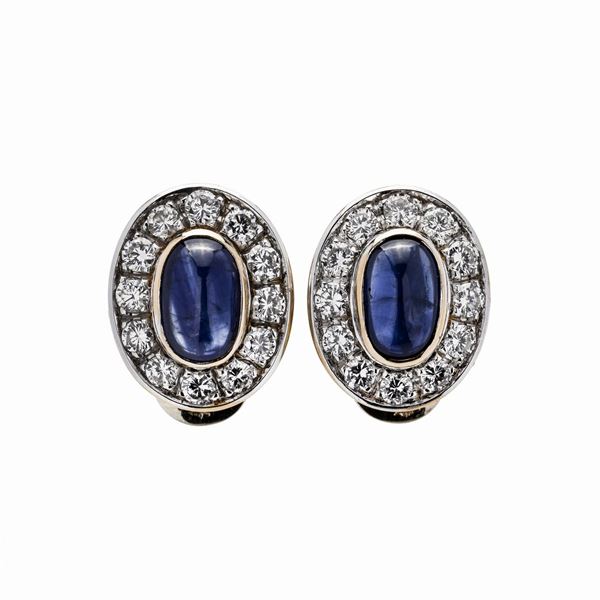 Pair of clip earrings in yellow gold, white gold, diamonds and sapphires