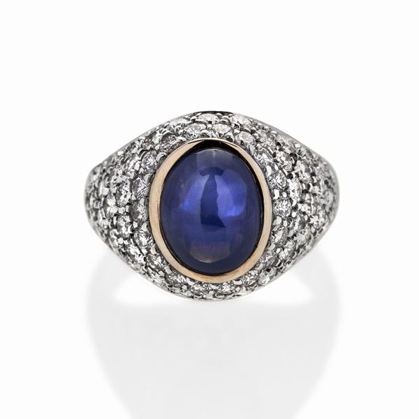 Ring in yellow gold, white gold, diamonds and sapphire