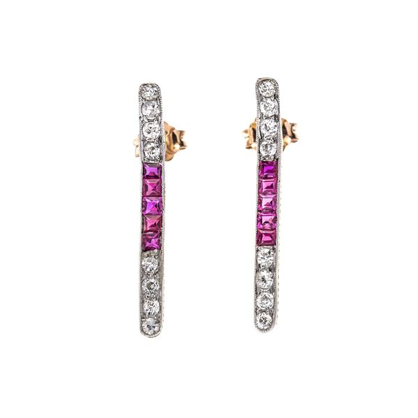 Pair of dangling earrings in platinum, yellow gold, diamonds and rubies