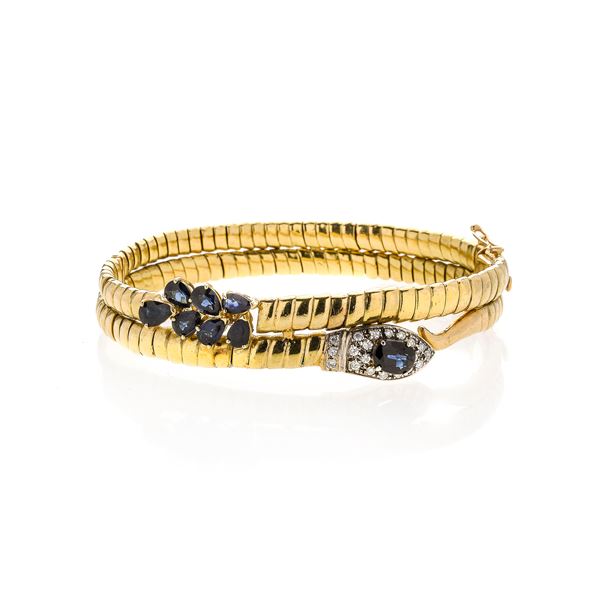 Snake bracelet in yellow gold, diamonds and sapphires