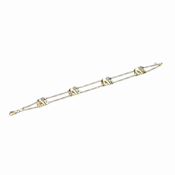 Bracciale in oro giallo, diamanti, rubino, smeraldo