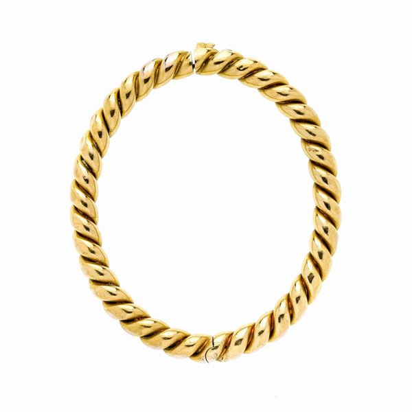 Bracciale rigido a torchionne in oro giallo