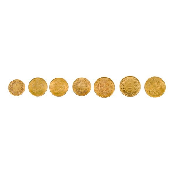 Sette monete varie in oro giallo