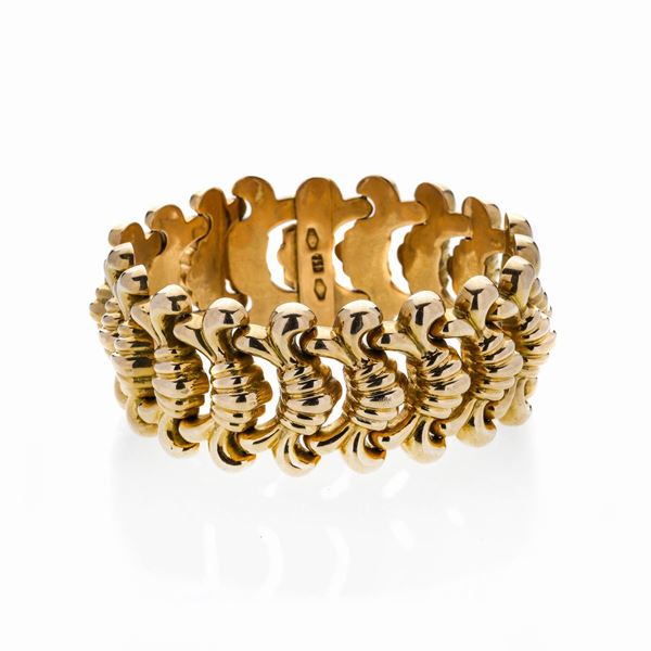 Alto bracciale in oro giallo
