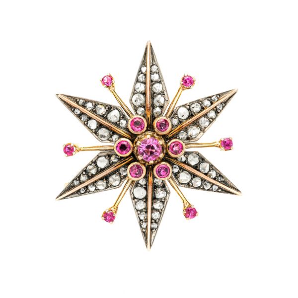 Star brooch in yellow gold, silver, diamonds and rubies