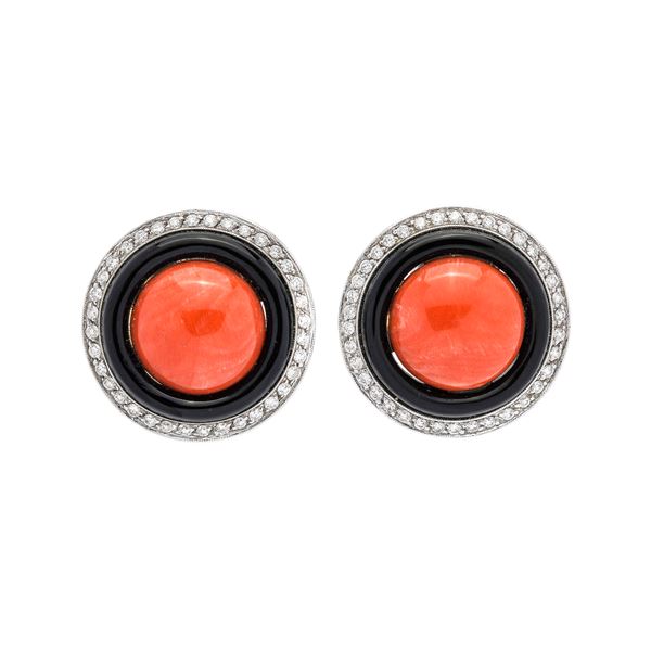 Pair of clip earrings in white gold, diamonds, onyx and red coral