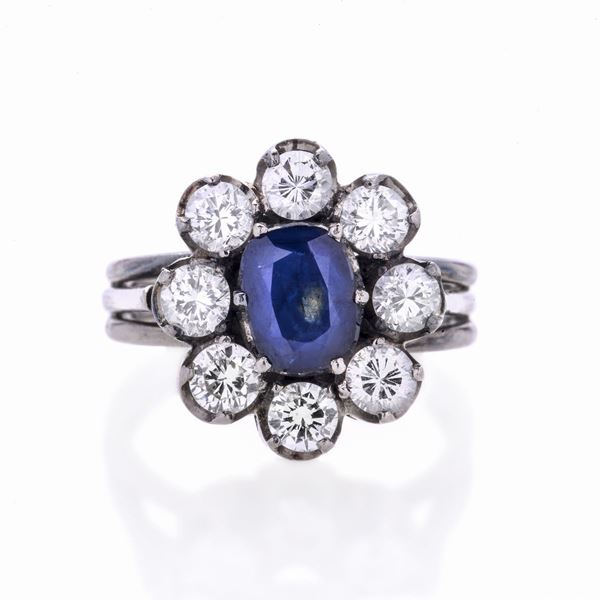 Daisy ring in white gold, diamonds and sapphire