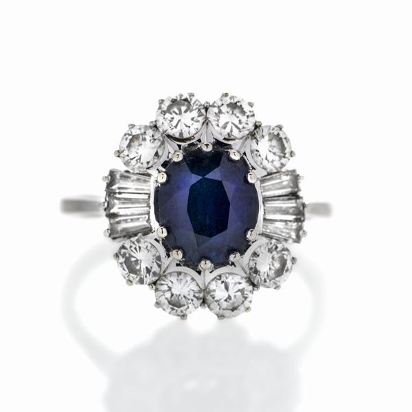 Ring in white gold, diamonds and sapphire