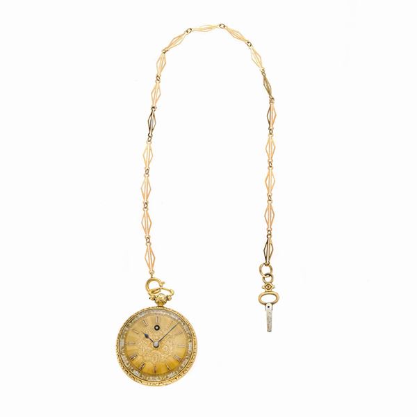 Pocket watch in yellow gold with chain and key