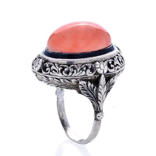 Silver ring, black nail polish and pink salmon coral