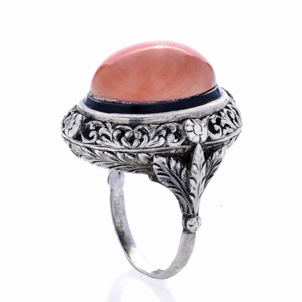 Silver ring, black nail polish and pink salmon coral