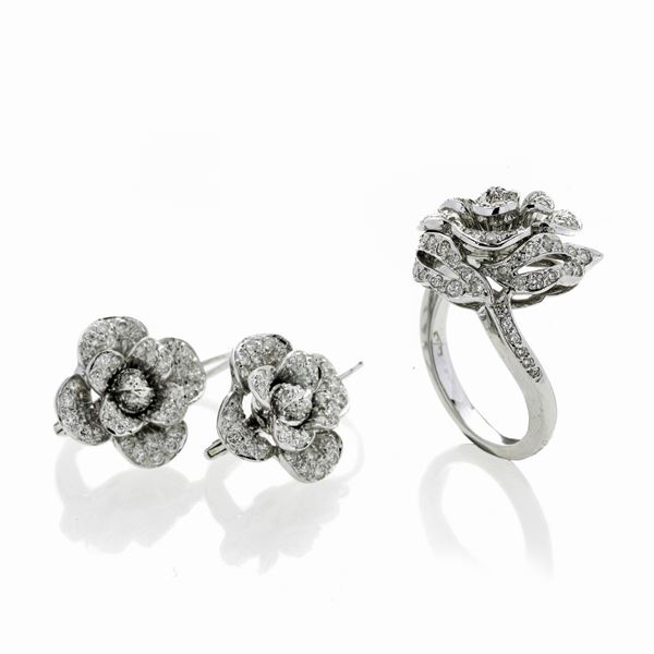 Pair of earrings and ring in white gold and diamonds