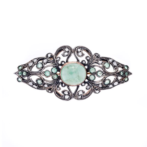 Brooch in low gold, silver and emeralds